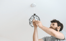 Man replacing the light fixture