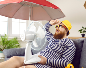 man in his home during the summer