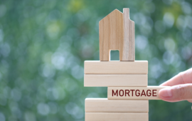 a pile of wooden blocks with the word "mortgage"