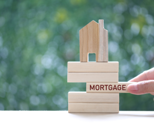 a pile of wooden blocks with the word "mortgage"