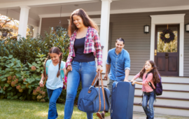 a happy family heading out the doorway