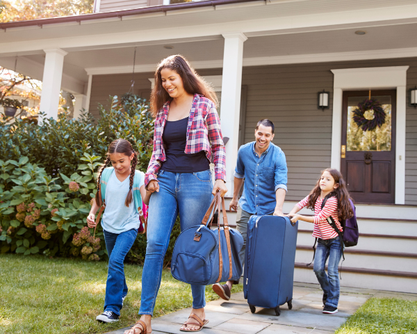 a happy family heading out the doorway