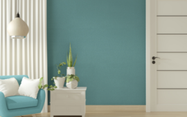 living room wall with teal paint and white accents