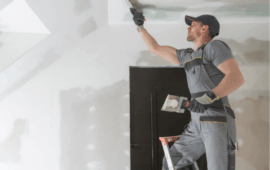 man painting the ceiling