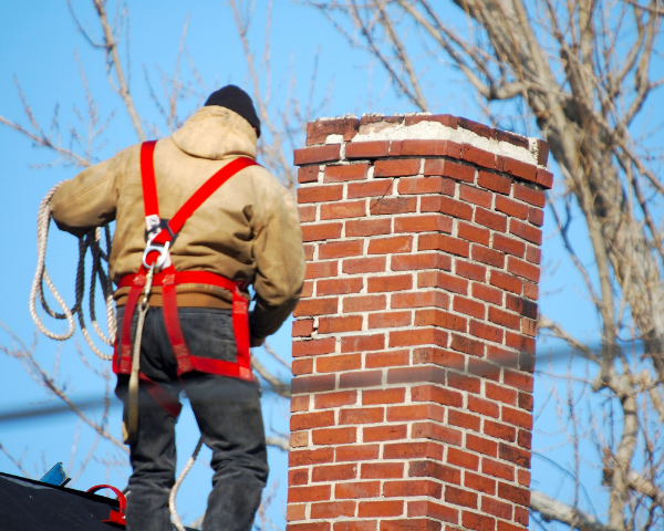 man checking the chimney