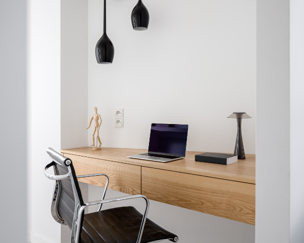 Sunlit kitchen with a glossy marble countertop, potted herbs, a wooden cutting board, and a bowl of apples near a window. Soft, warm ambiance.