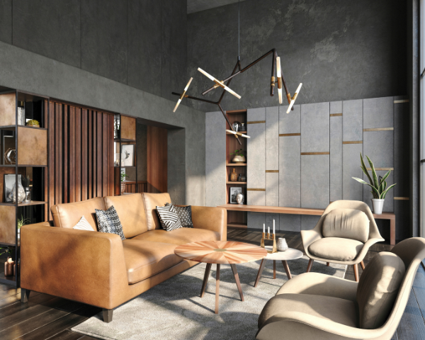 Modern industrial living room with tan leather sofa, sculptural chairs, wood coffee table, pendant lights, plants, and warm sunlight.